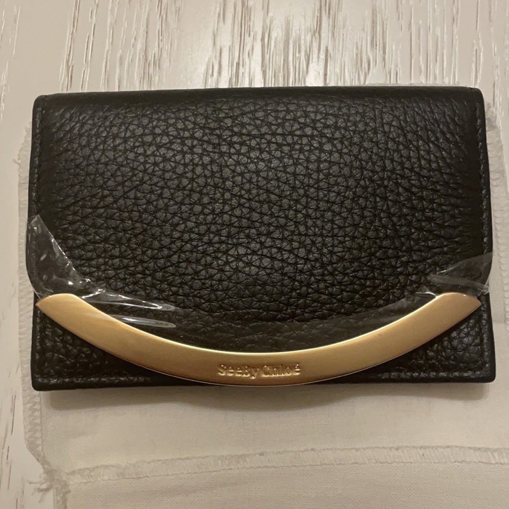 “Lizzie” wallet in black by See by Chloè
